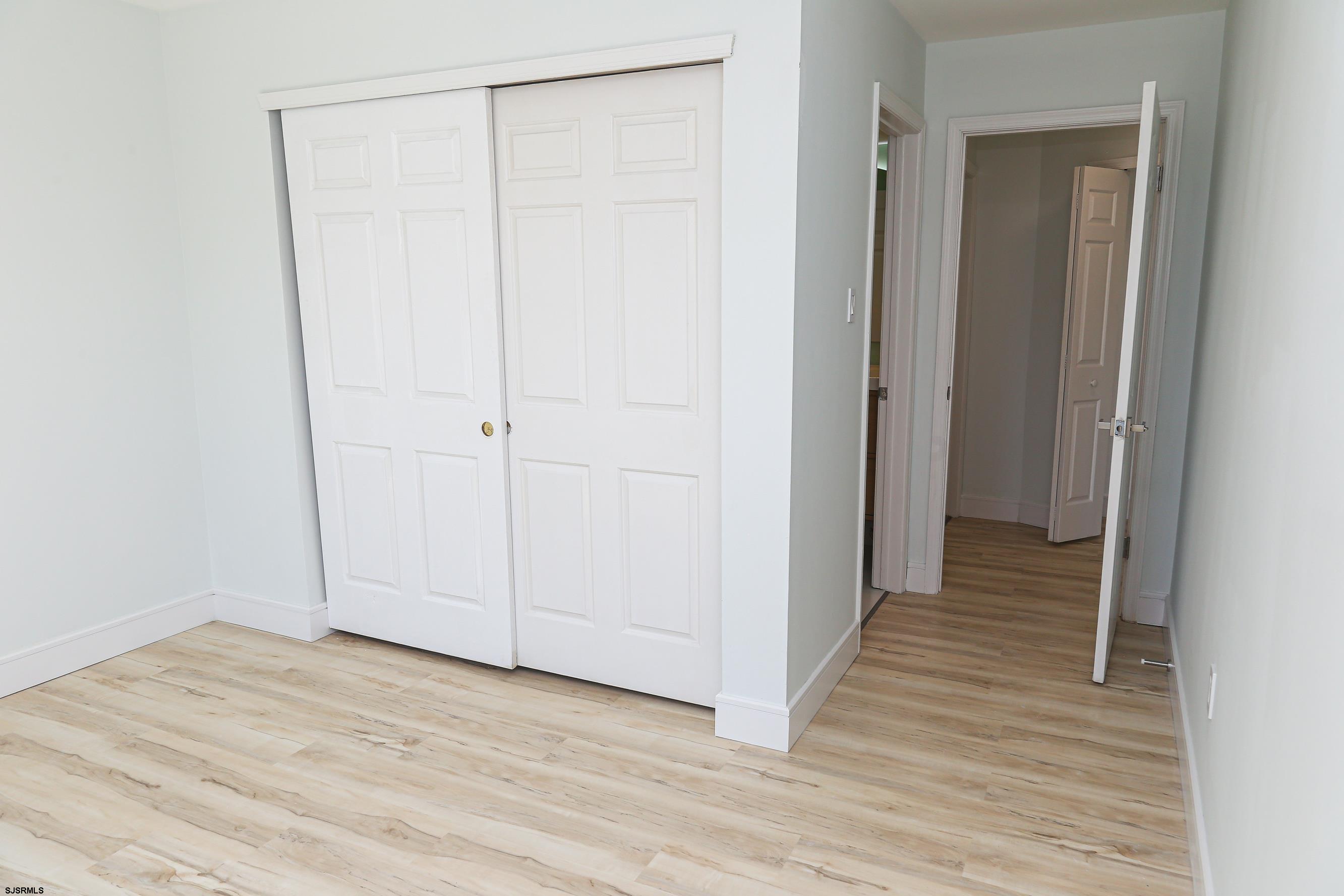 169 40th Street South, Unit 38 Brigantine, NJ 08203 - Photo 36 of 79 a view of a room with wooden floor