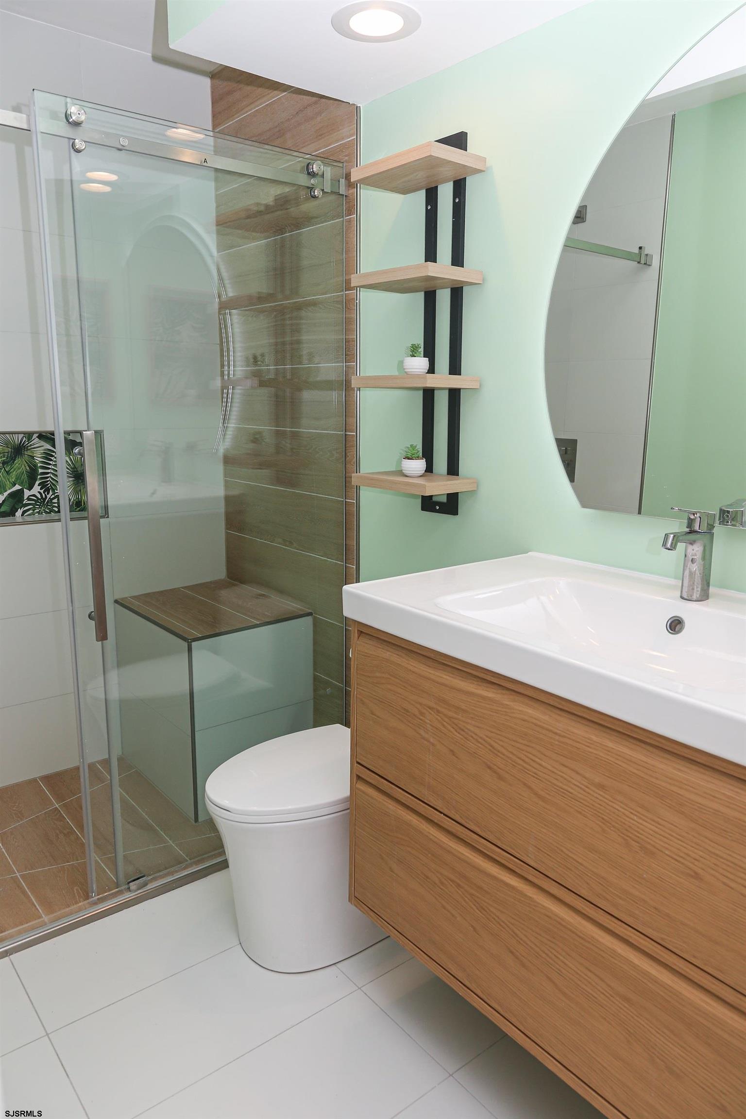 169 40th Street South, Unit 38 Brigantine, NJ 08203 - Photo 37 of 79 a bathroom with a sink toilet and shower