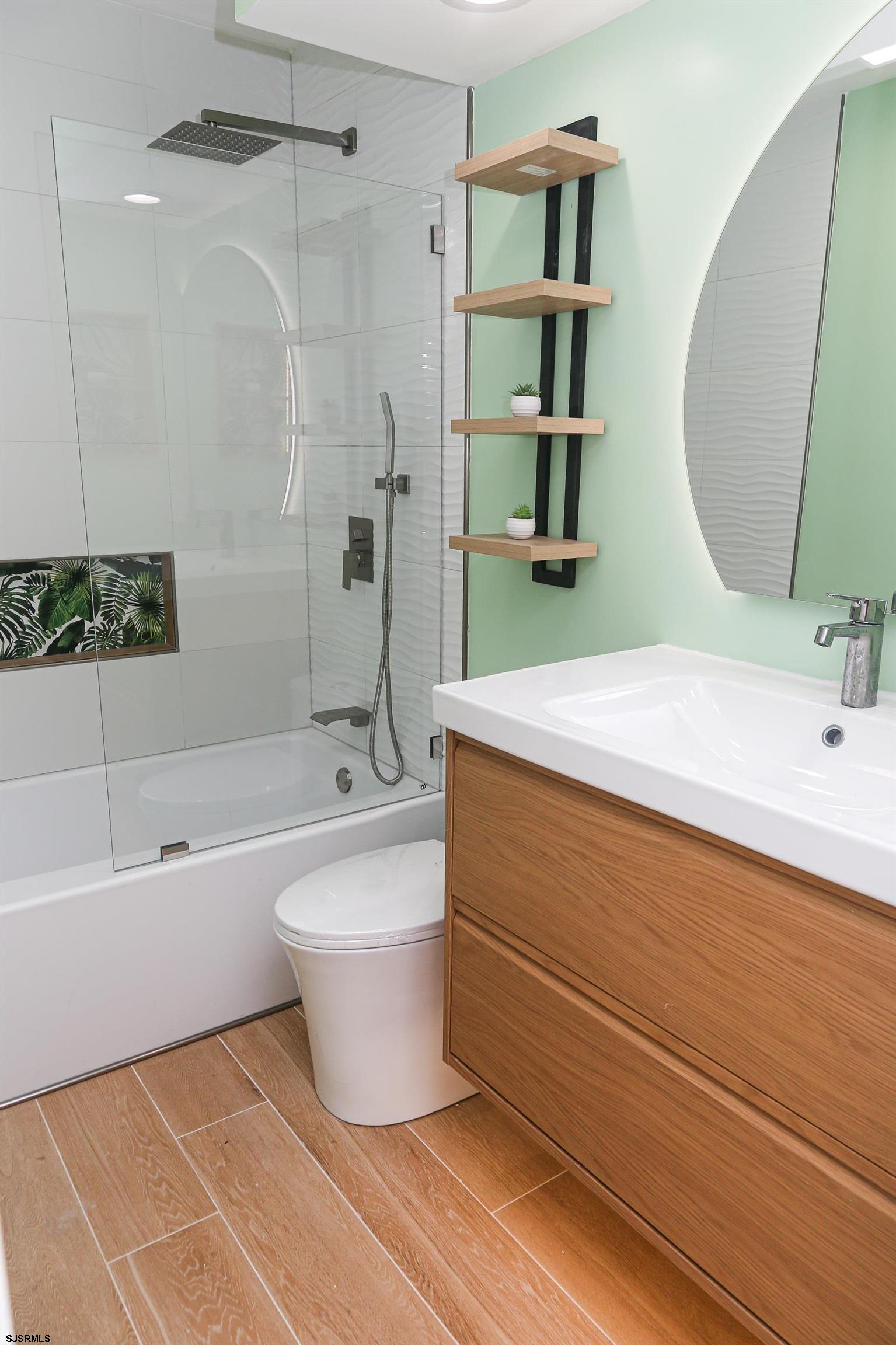 169 40th Street South, Unit 38 Brigantine, NJ 08203 - Photo 42 of 79 a bathroom with a bathtub sink and toilet