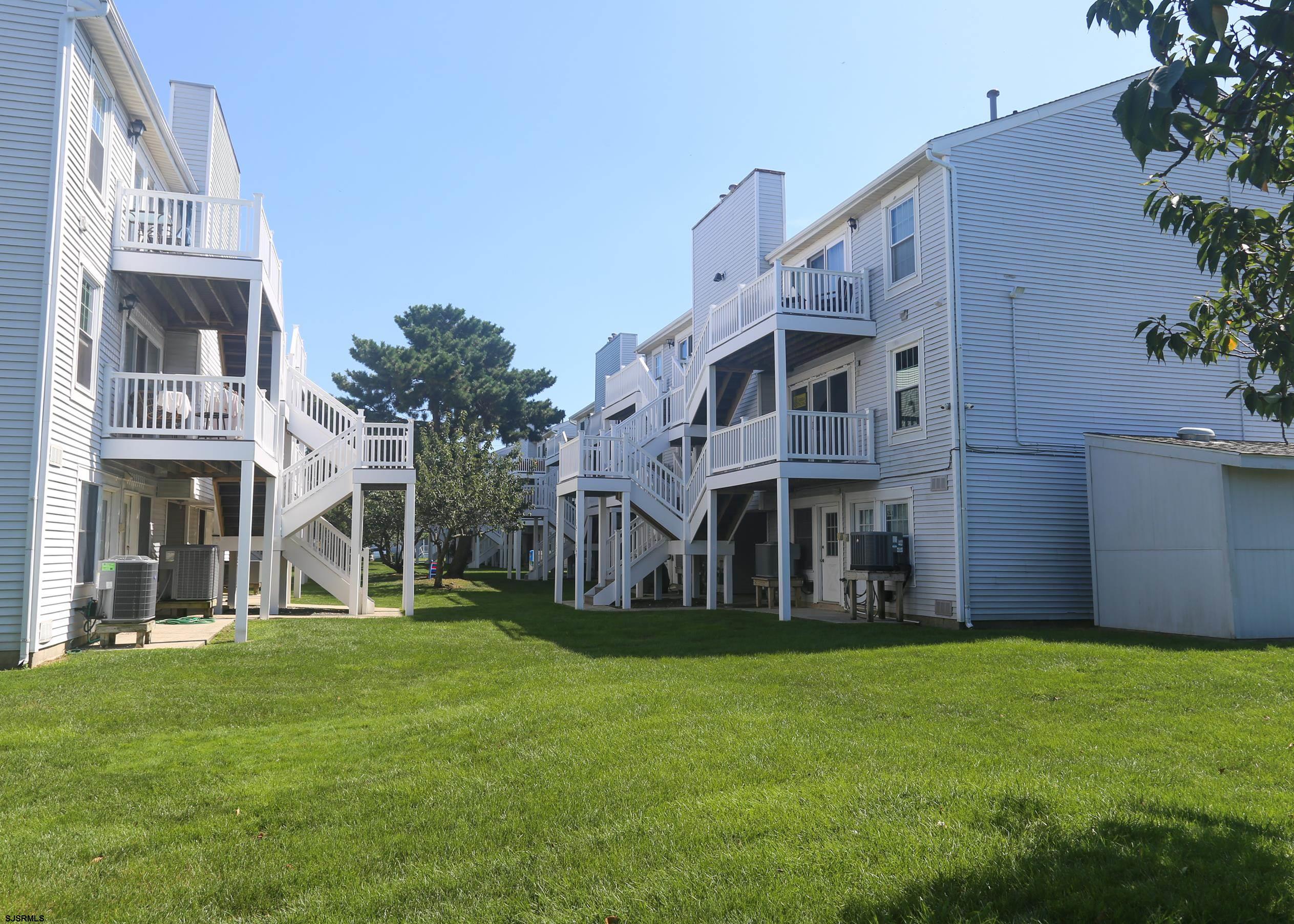 169 40th Street South, Unit 38 Brigantine, NJ 08203 - Photo 48 of 79 a view of a house with a yard