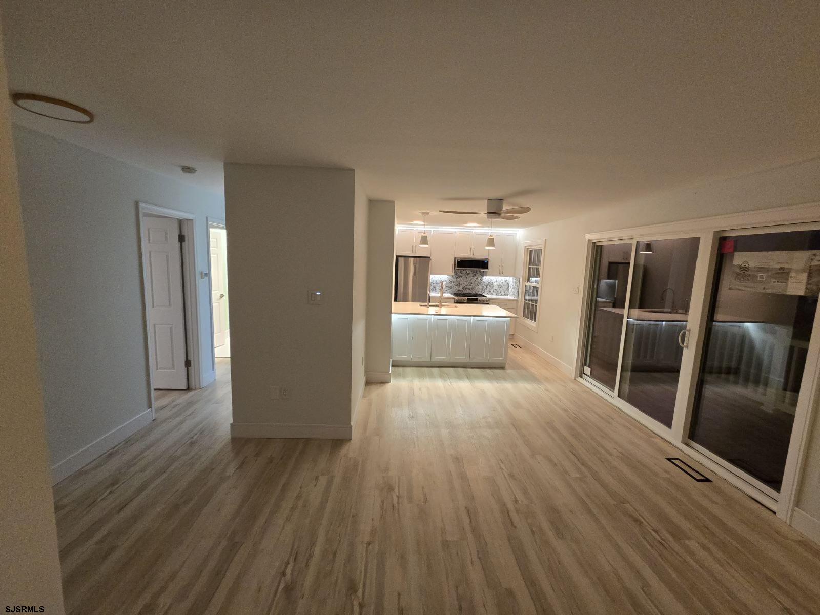 169 40th Street South, Unit 38 Brigantine, NJ 08203 - Photo 52 of 79 a view of a kitchen with wooden floor electronic appliances and window