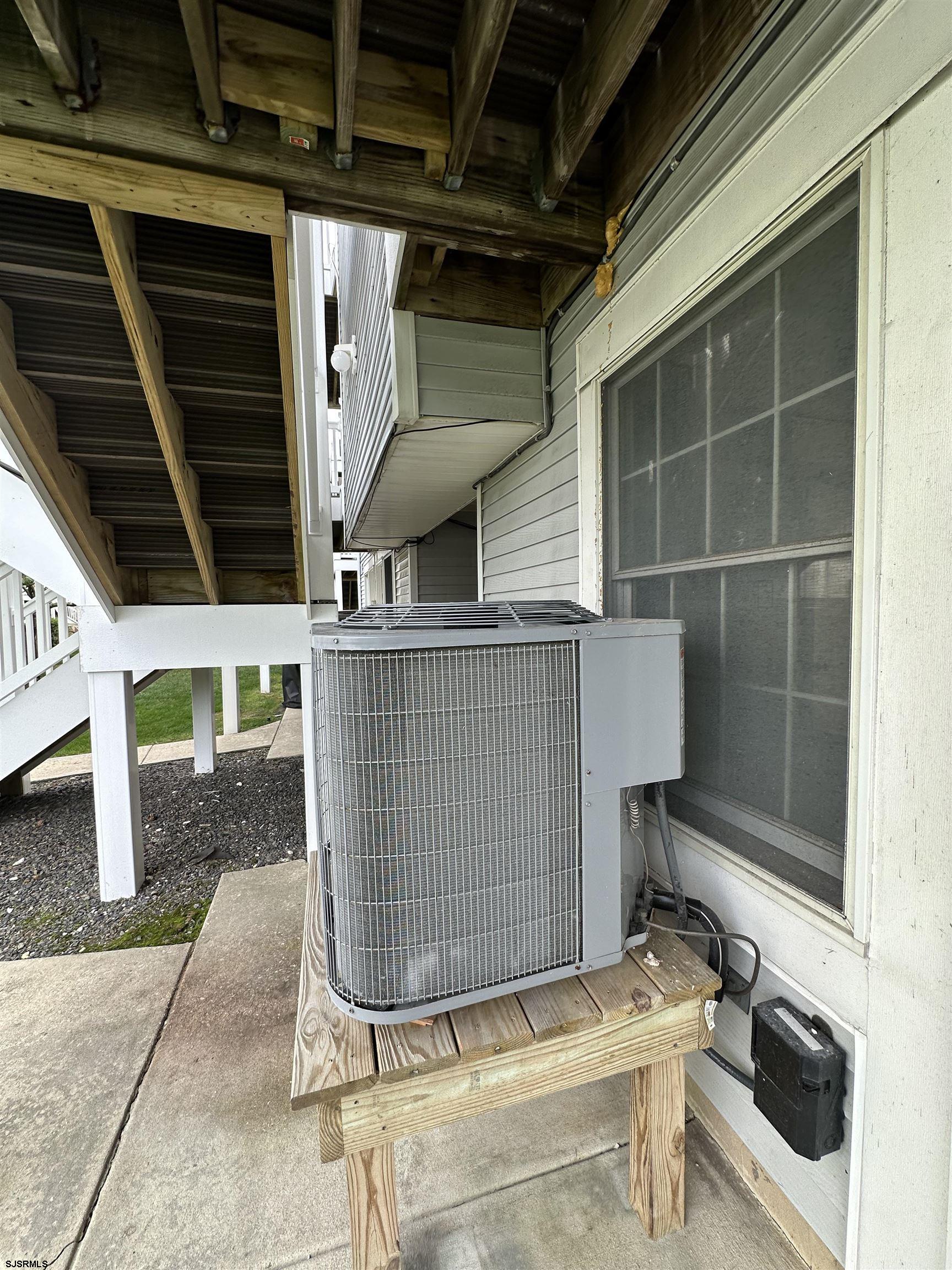 169 40th Street South, Unit 38 Brigantine, NJ 08203 - Photo 74 of 79 a view of house with wooden floor and a chair