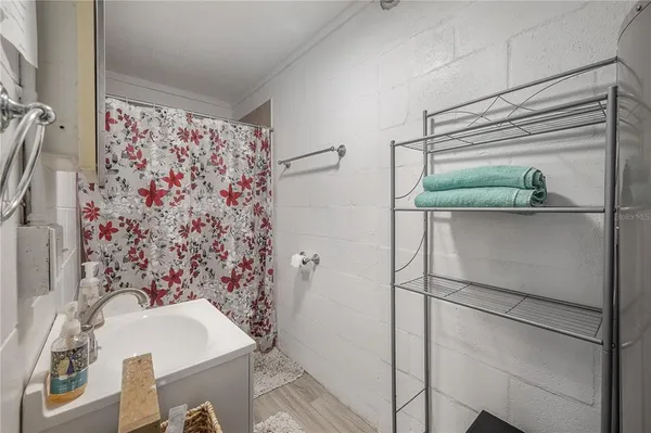 a bathroom with a bathtub and shower