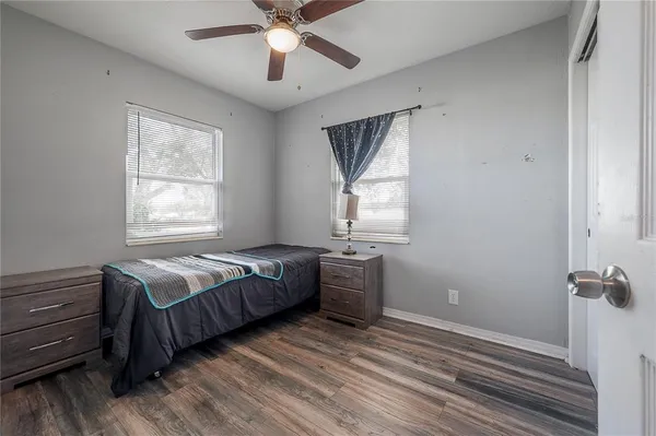 a bedroom with a bed and window