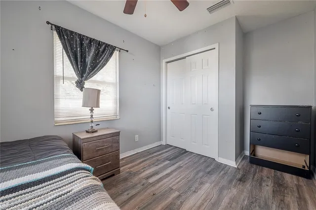 a bedroom with a bed and a dresser