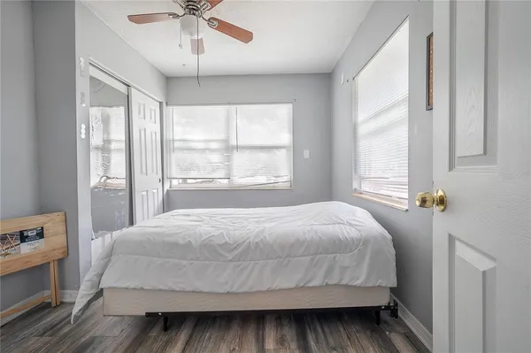 a bedroom with a bed and window