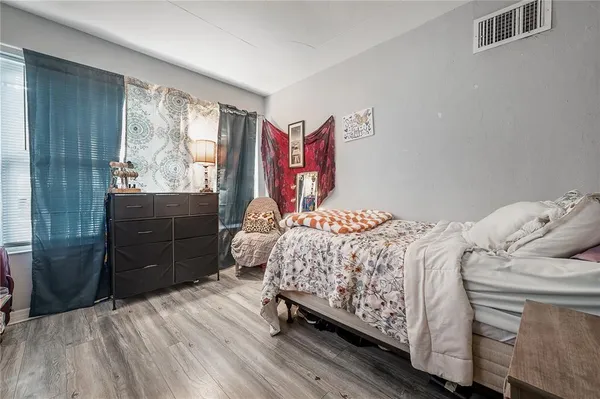 a bedroom with a bed and a closet