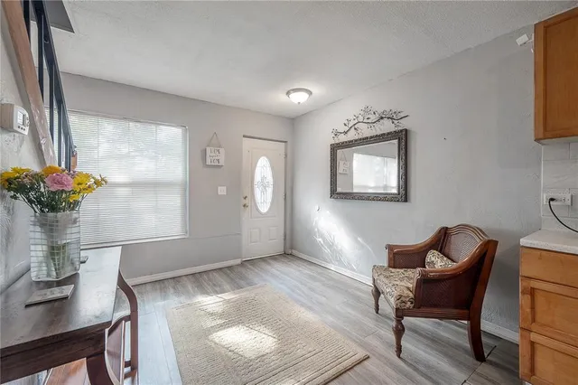 a workspace with furniture and a potted plant