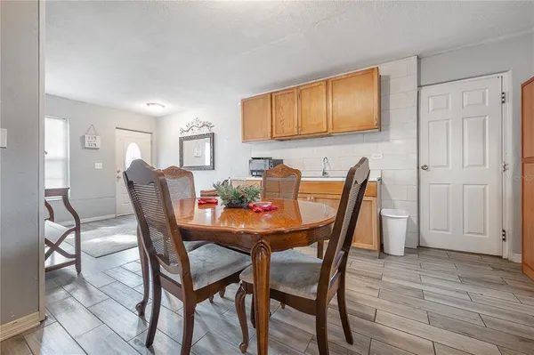 a dining room with furniture and window