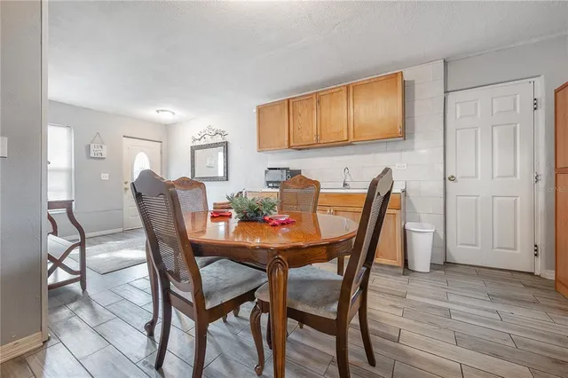 a dining room with furniture and window