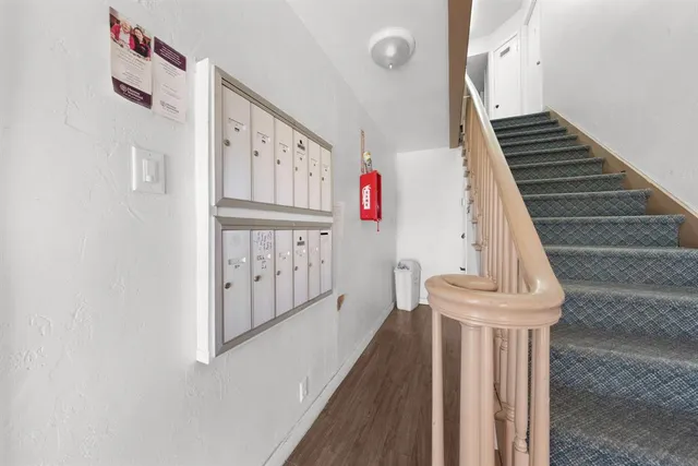 a view of entryway with furniture and stairs