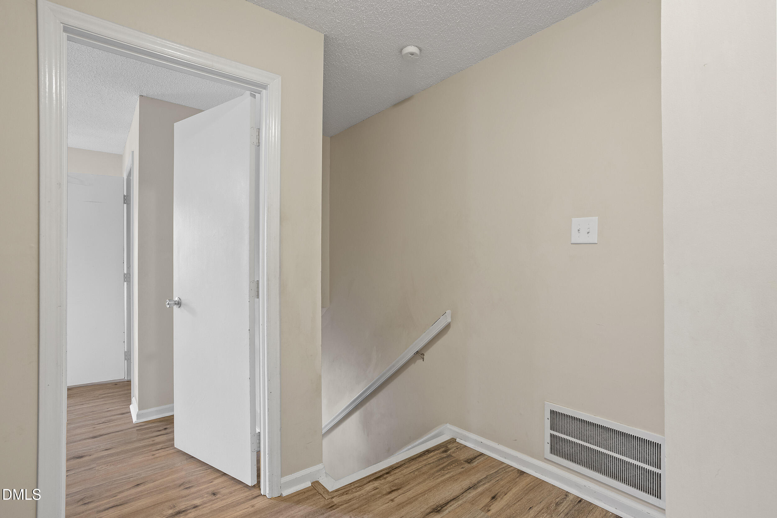 1801 Quail Ridge Road Raleigh, NC 27609 - Photo 14 of 29 a view of a hallway with wooden floor