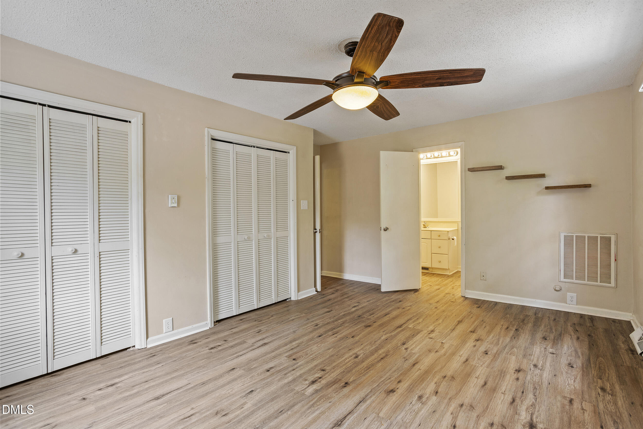 1801 Quail Ridge Road Raleigh, NC 27609 - Photo 17 of 29 a view of empty room with wooden floor