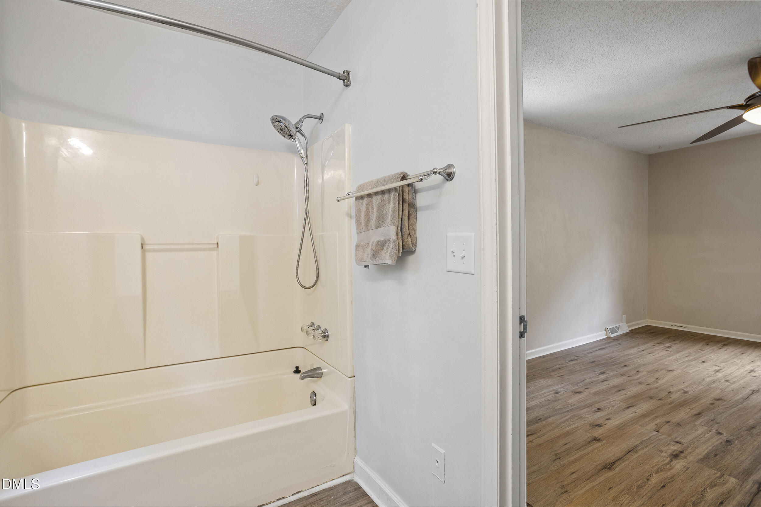 1801 Quail Ridge Road Raleigh, NC 27609 - Photo 19 of 29 a bathroom with a bathtub and a shower