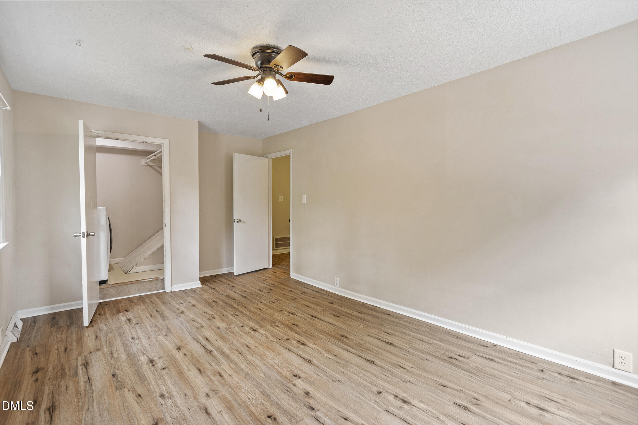 1801 Quail Ridge Road Raleigh, NC 27609 - Photo 24 of 29 wooden floor in an empty room with a window