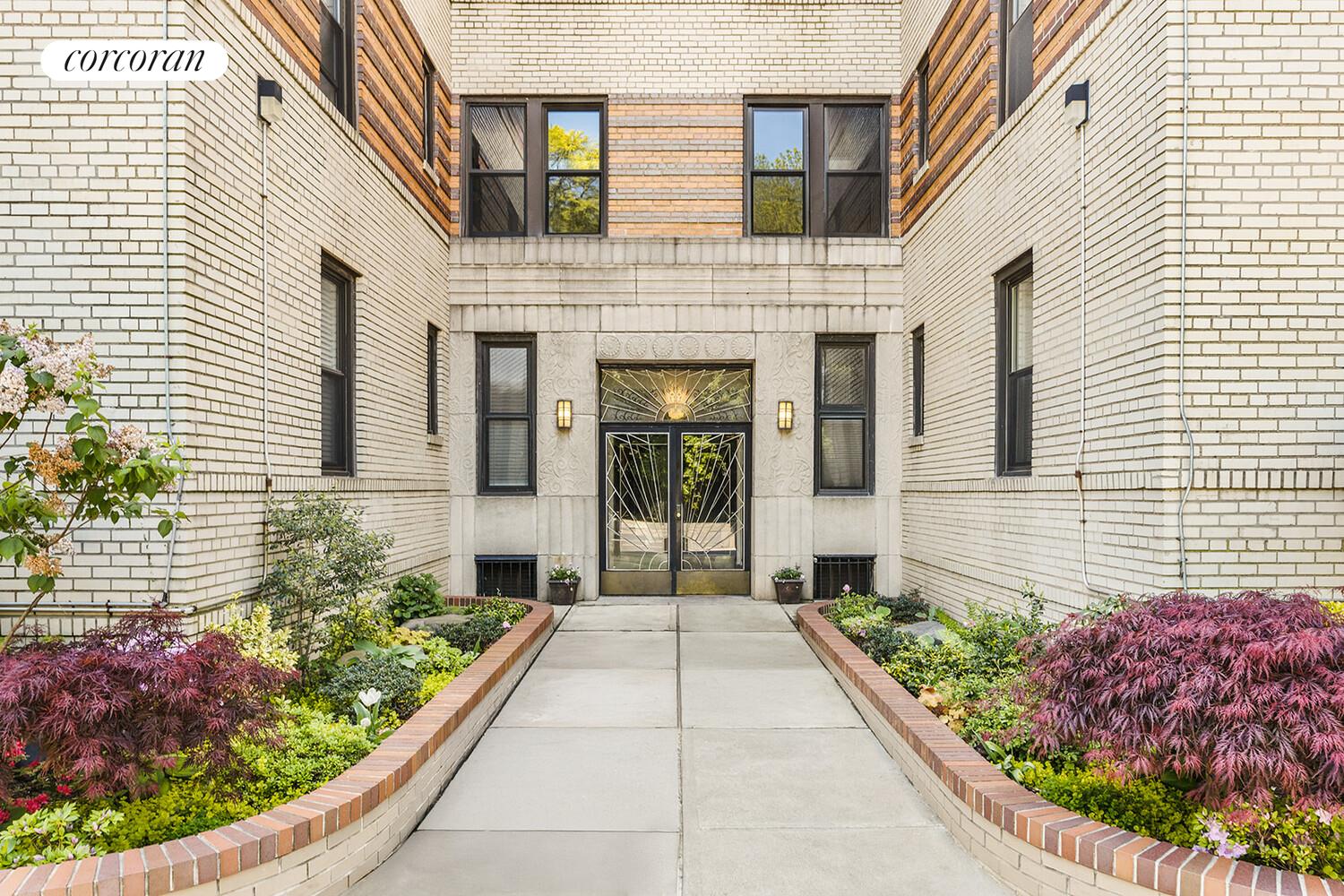 75 Prospect Park Southwest, Unit E8 Brooklyn, NY 11215 - Photo 10 of 11 a front view of a house with a garden