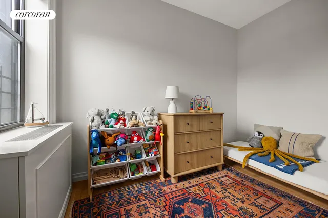 a living room with a flat screen tv and furniture
