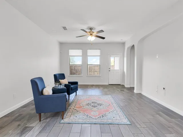 a living room with furniture and a rug