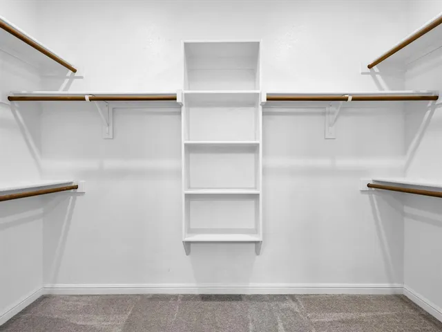 a view of an empty walk in closet