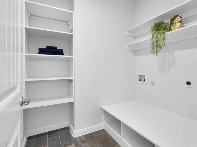 a hallway with cabinet