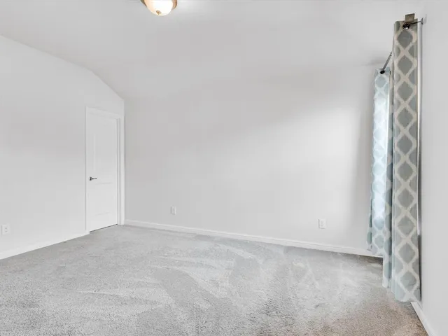 a bathroom with a sink a toilet a mirror and shower