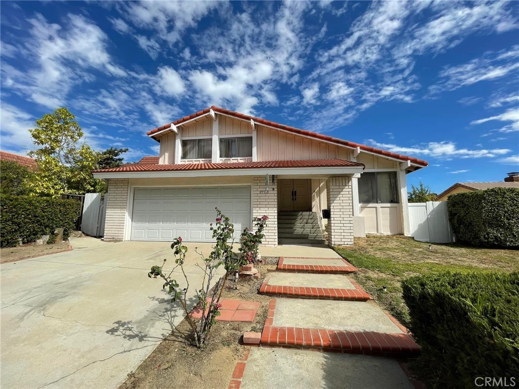 1752 Maple Hill Road Diamond Bar, CA 91765 - Photo 1 of 1 a front view of a house with a yard