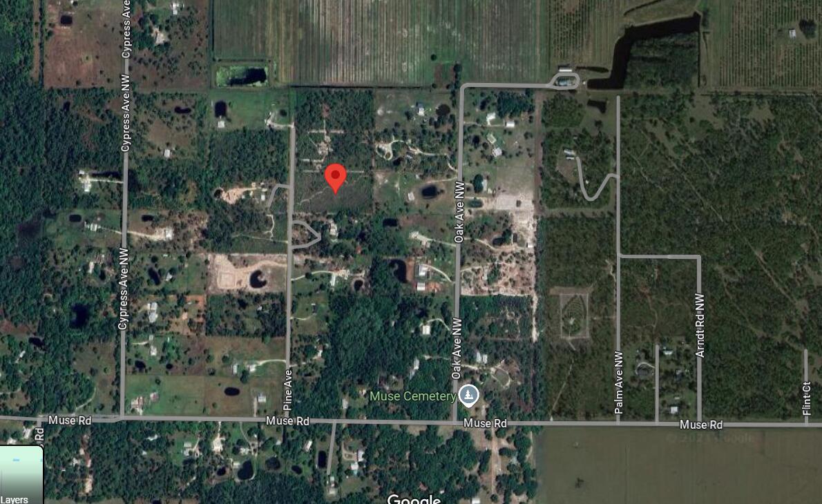 680 Pine Avenue LaBelle, FL 33935 - Photo 8 of 8 a view of a house with a glass door