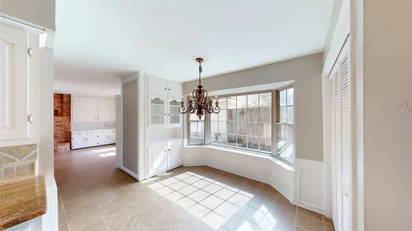 a bathroom with a glass door shower and sink