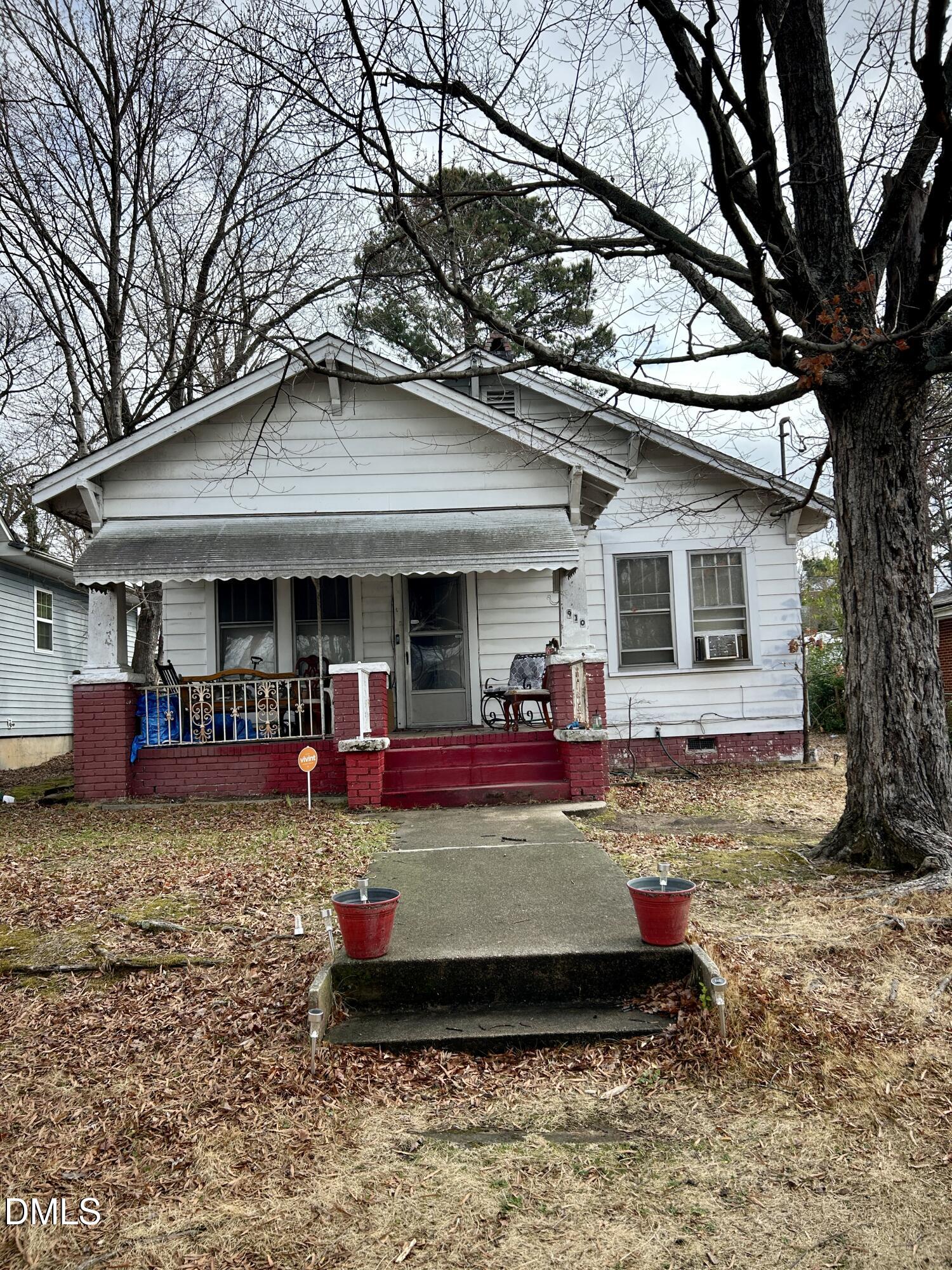 a front view of a house with swimming pool