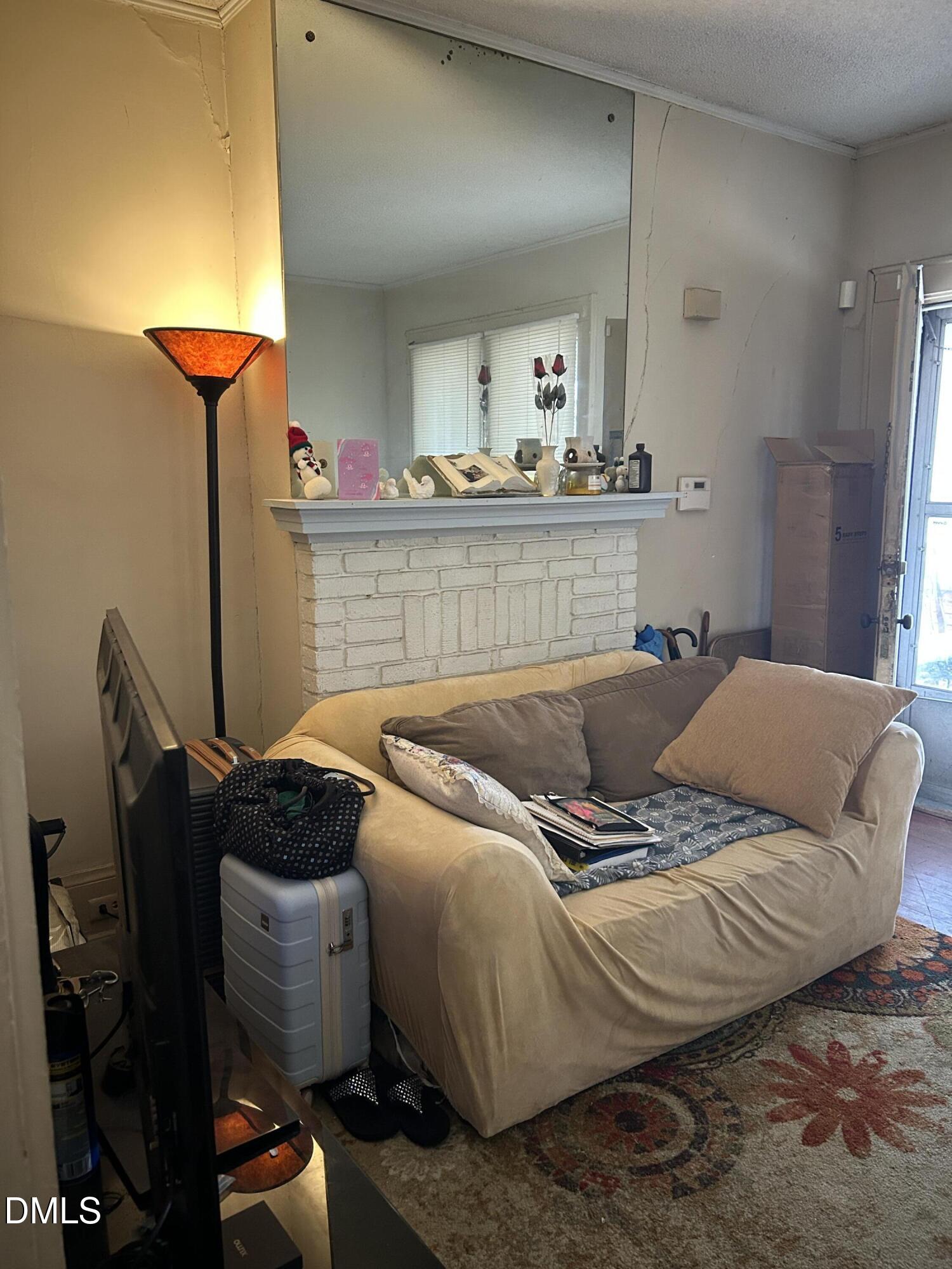 910 Chester Street Durham, NC 27701 - Photo 2 of 9 a living room with furniture and a fireplace