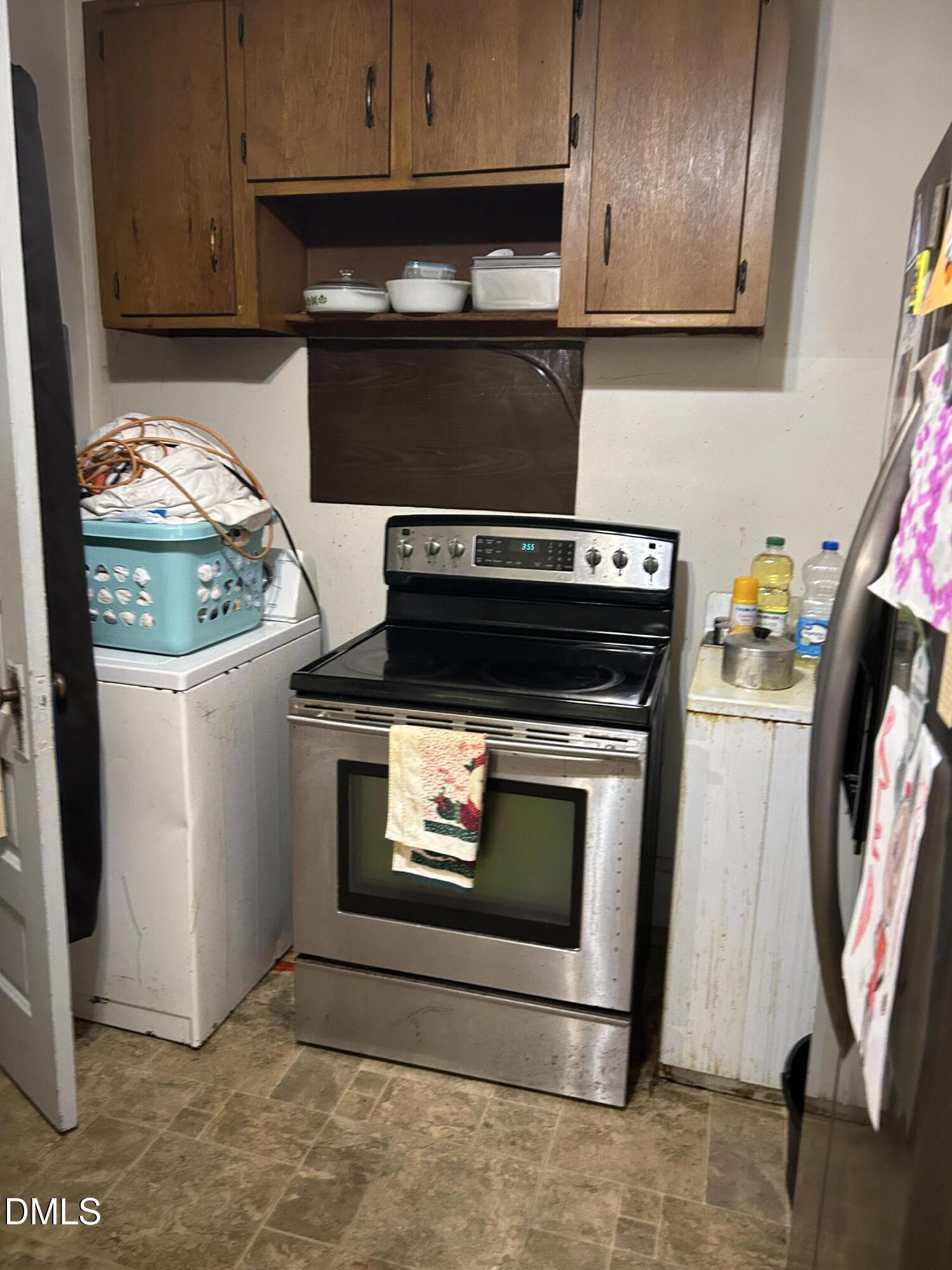 910 Chester Street Durham, NC 27701 - Photo 4 of 9 a stove top oven sitting inside of a kitchen
