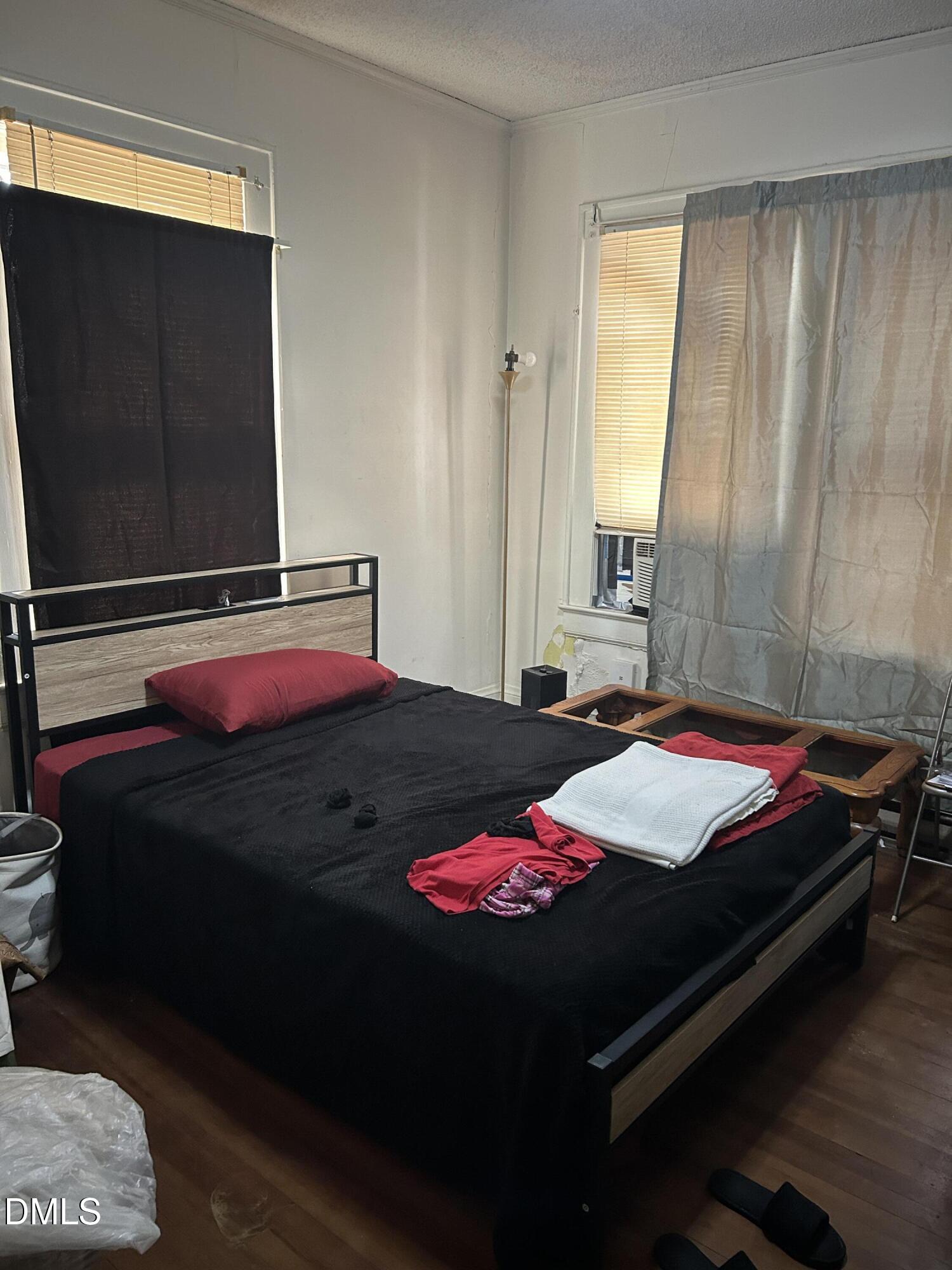 910 Chester Street Durham, NC 27701 - Photo 6 of 9 a bedroom with a bed and window