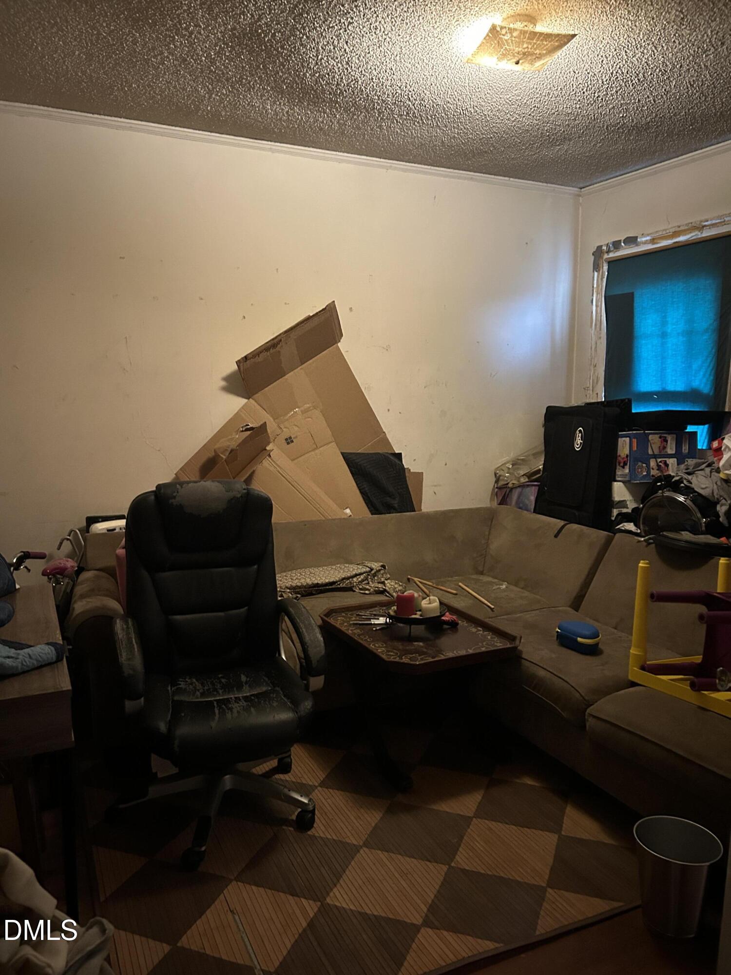 910 Chester Street Durham, NC 27701 - Photo 7 of 9 a living room with furniture and a flat screen tv
