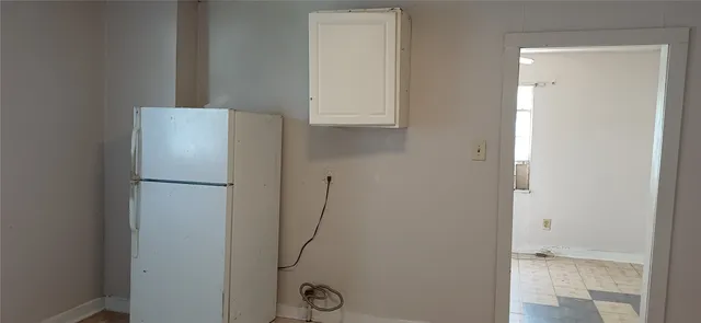 a white refrigerator freezer and a table