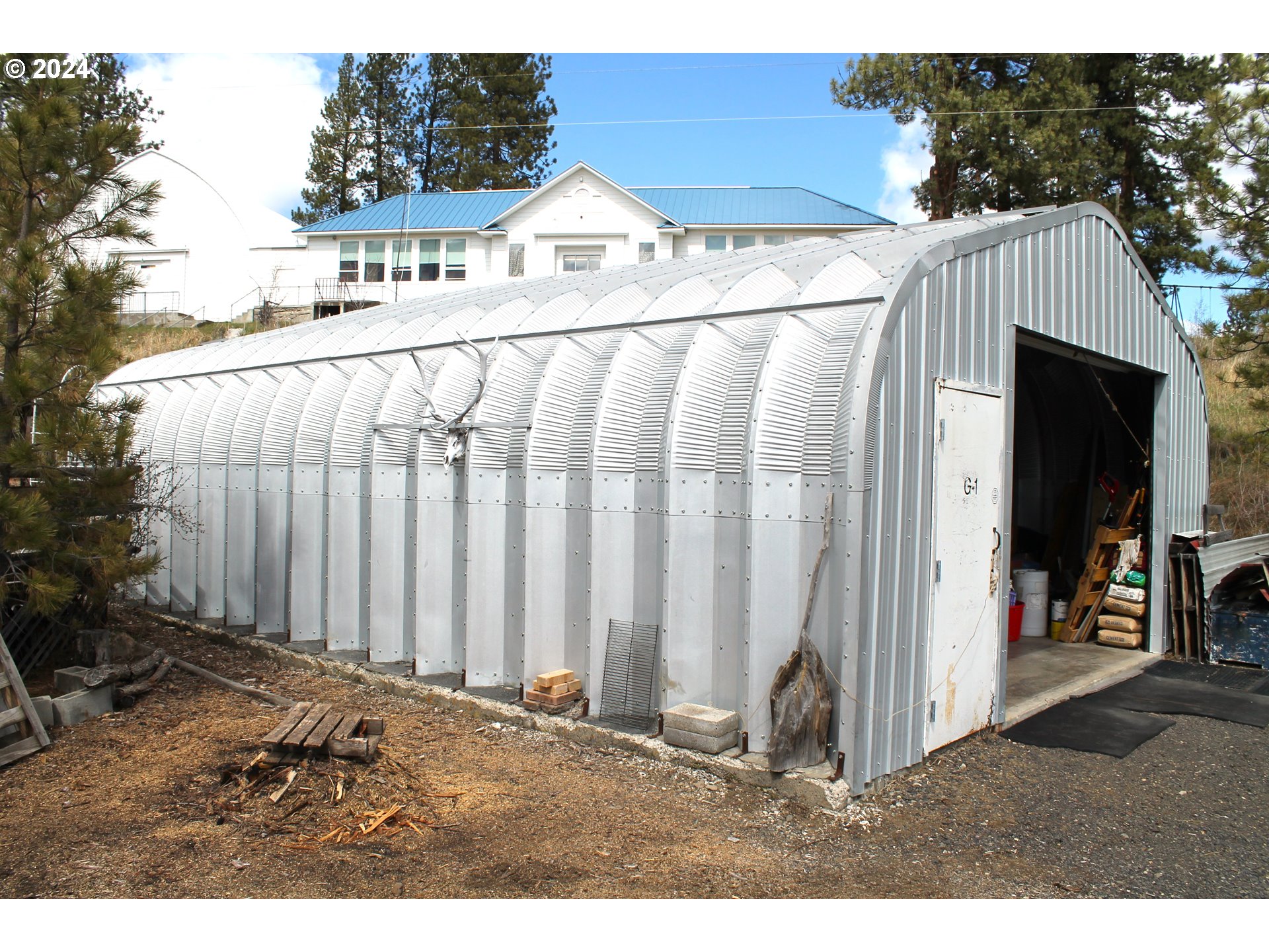 205 Camas Street Ukiah, OR 97880 - Photo 18 of 41 a white house with a outdoor space