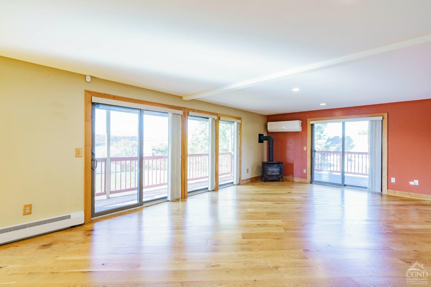 38 Cheviot Road, Unit 8 Germantown, NY 12526 - Photo 11 of 28 a view of an empty room with wooden floor and a window