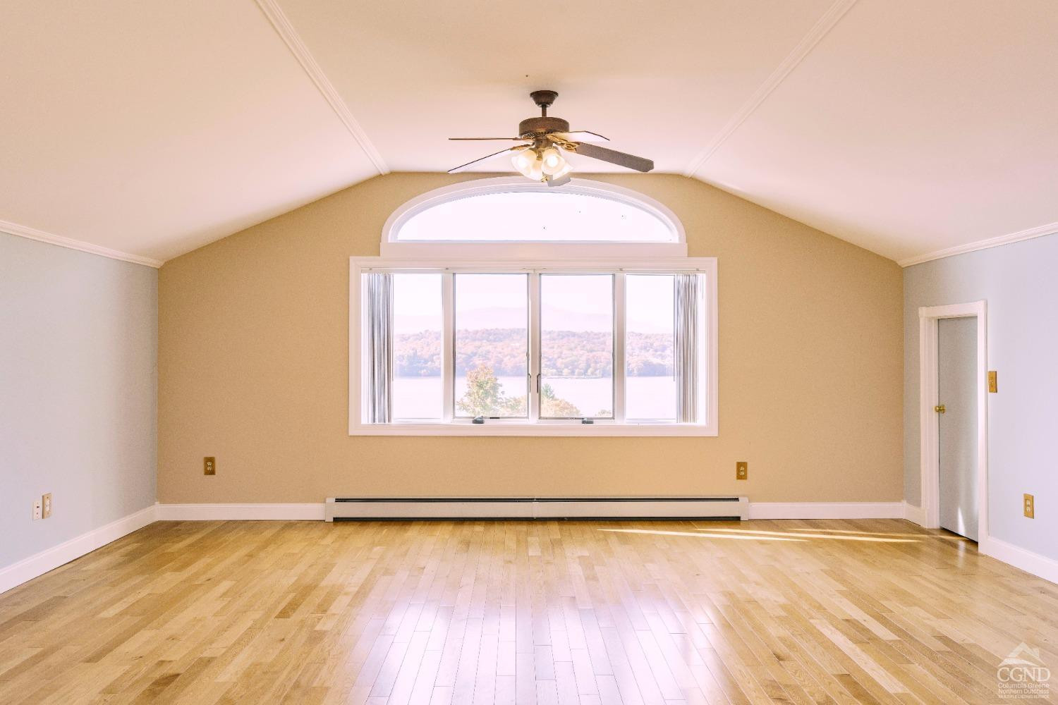 38 Cheviot Road, Unit 8 Germantown, NY 12526 - Photo 20 of 28 an empty room with wooden floor and windows