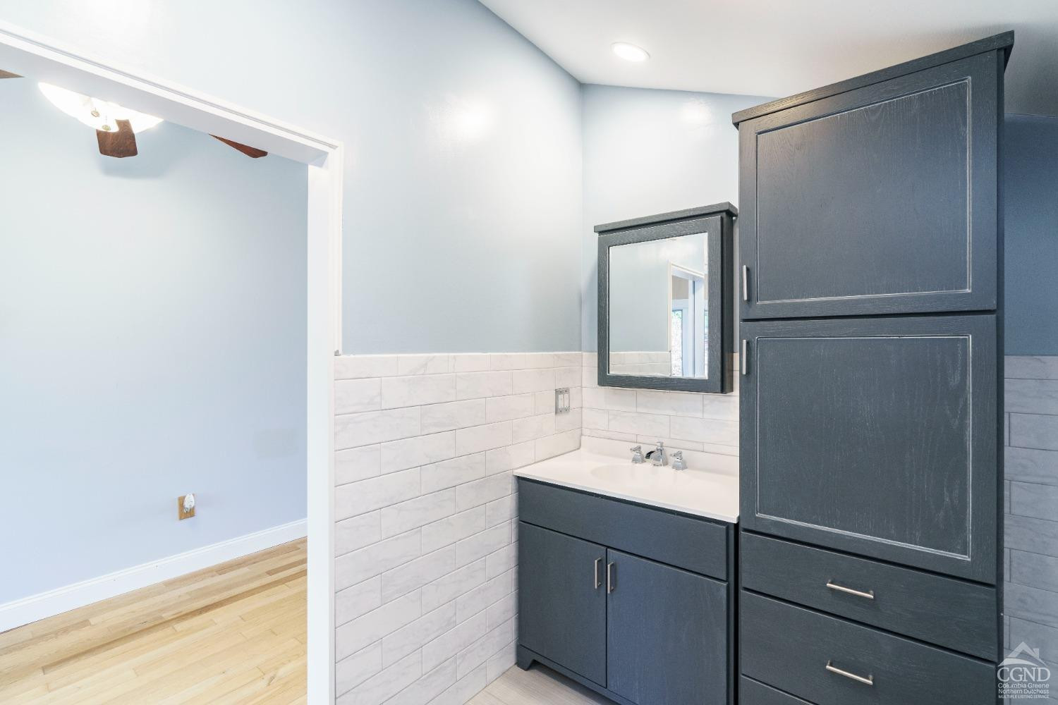 38 Cheviot Road, Unit 8 Germantown, NY 12526 - Photo 22 of 28 a bathroom with a sink and mirror