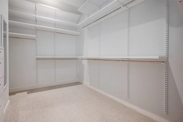 a view of an empty walk in closet