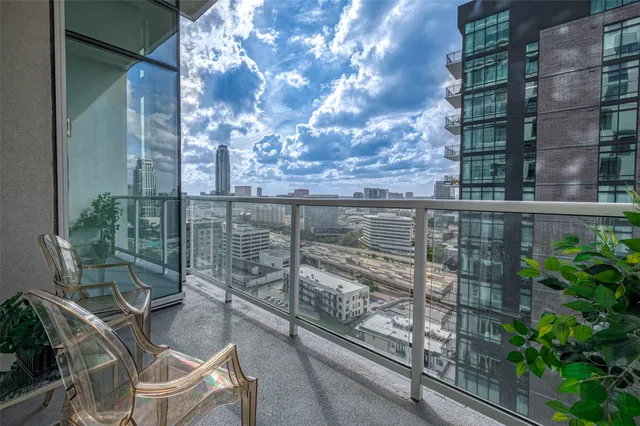 a view of a balcony with a potted plant