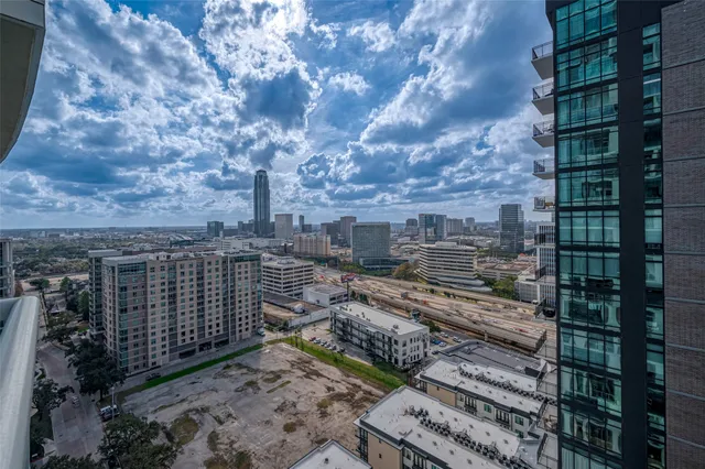 a view of a buildings with a yard