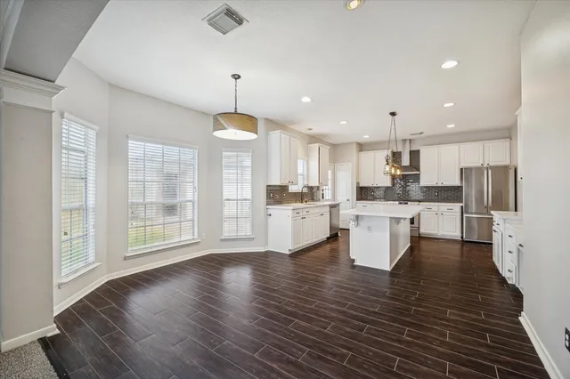 a view of kitchen with wooden floor