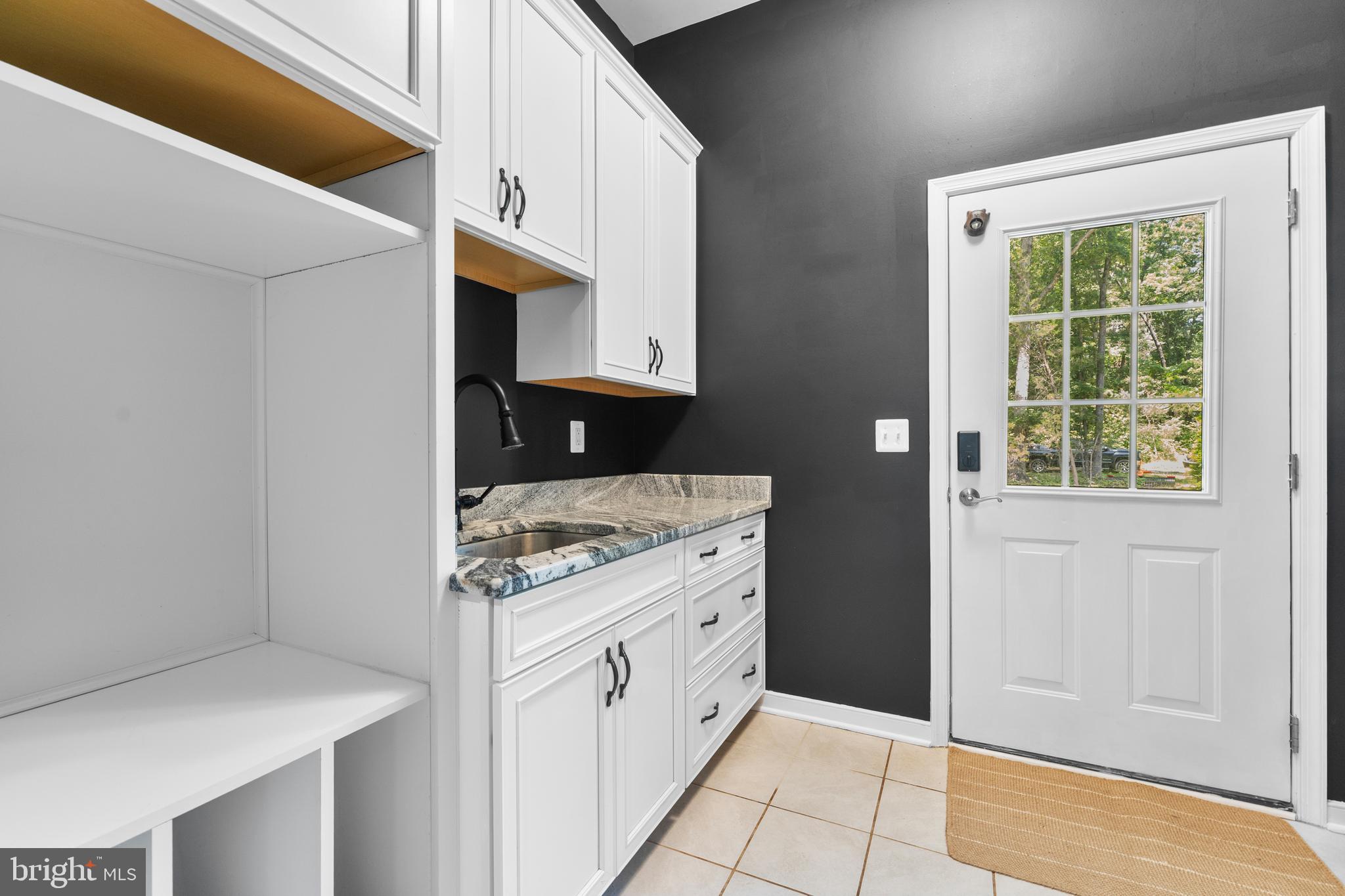 80 Shackelford Well Road Fredericksburg, VA 22406 - Photo 35 of 108 a kitchen with stainless steel appliances granite countertop a stove and a refrigerator