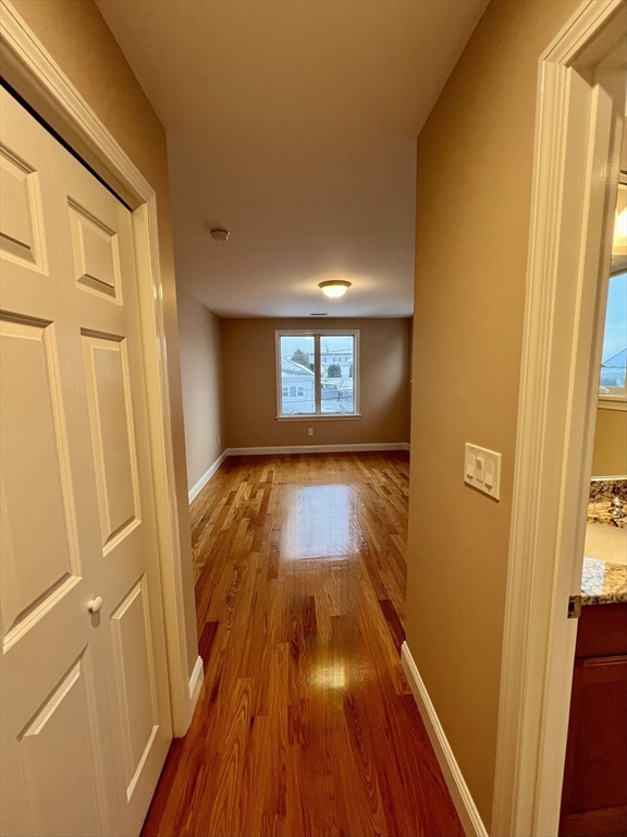 31 Rand Street, Unit 2 Revere, MA 02151 - Photo 5 of 15 a view of a hallway with wooden floor
