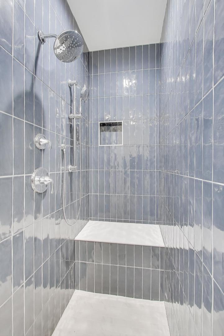 894 North Quentin Road Palatine, IL 60067 - Photo 18 of 29 a bathroom with a bathtub and shower
