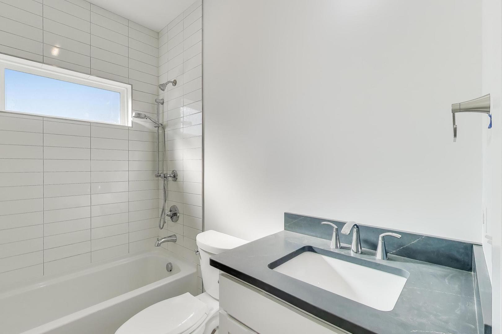 894 North Quentin Road Palatine, IL 60067 - Photo 21 of 29 a bathroom with a sink toilet and shower