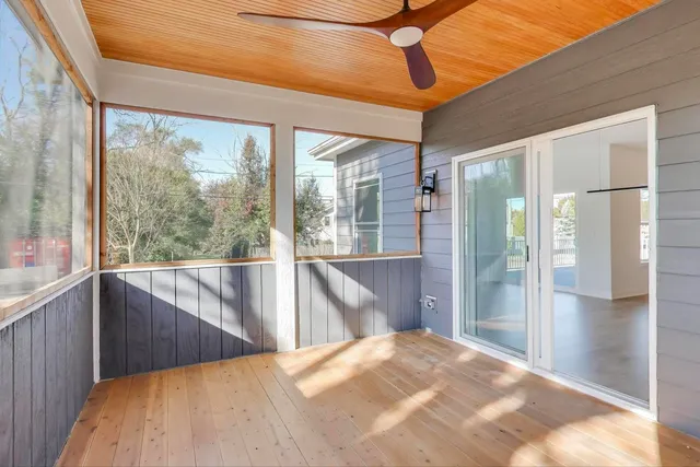 a view of a balcony with wooden floor