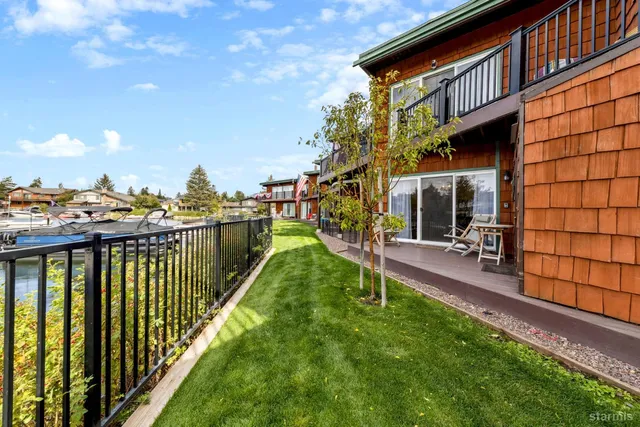 a view of a house with backyard porch and sitting area