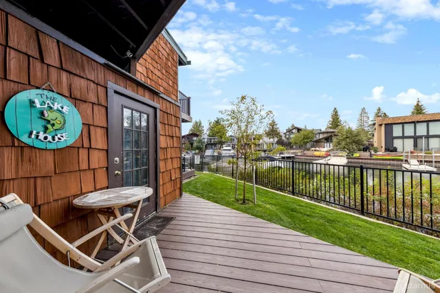 a view of a lake with chairs