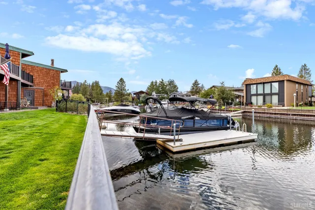 a view of a lake with boats and trees in the background